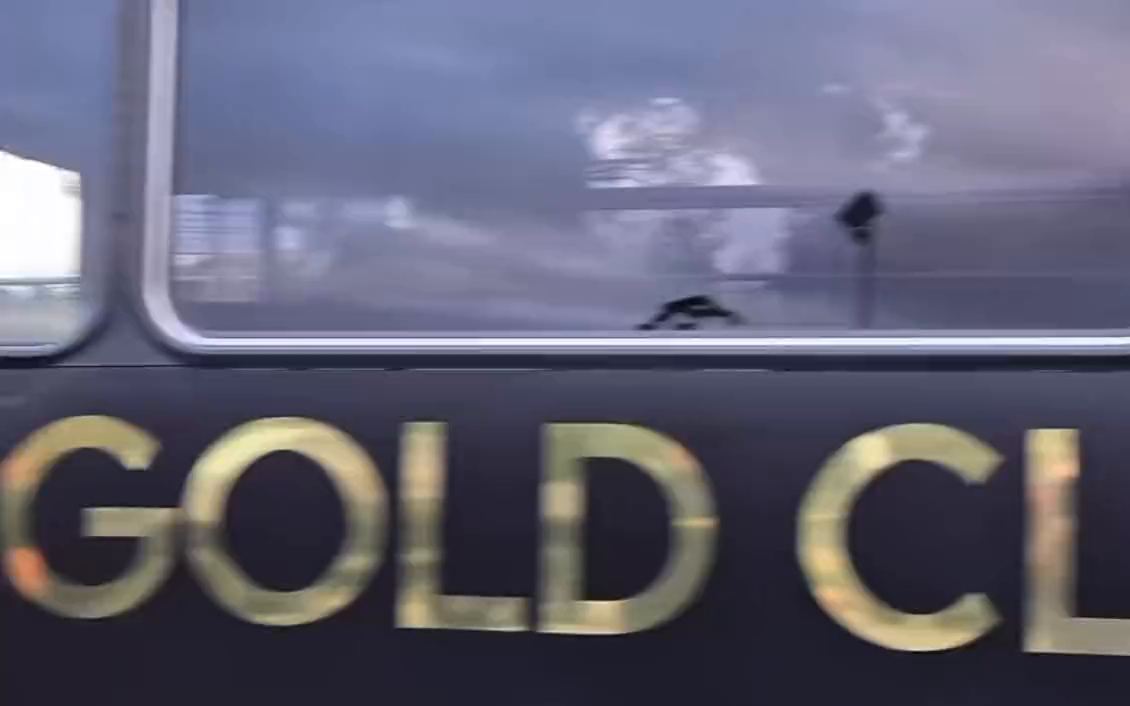 The side of the black Gold Class party bus, with GOLD CLASS PARTY BUS in gold letters