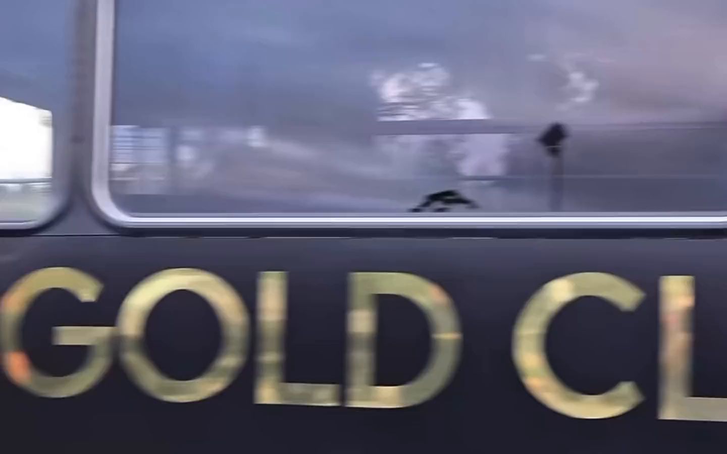 The side of the black Gold Class party bus, with GOLD CLASS PARTY BUS in gold letters